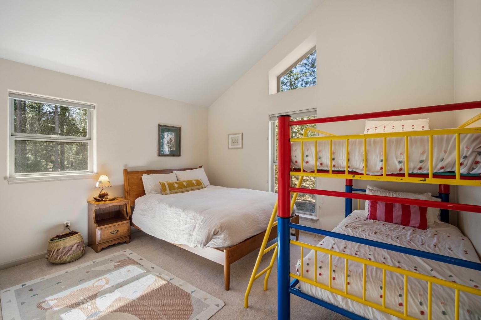 Guest bedroom view with closet storage and warm natural light, suitable for visitors or flexible use.