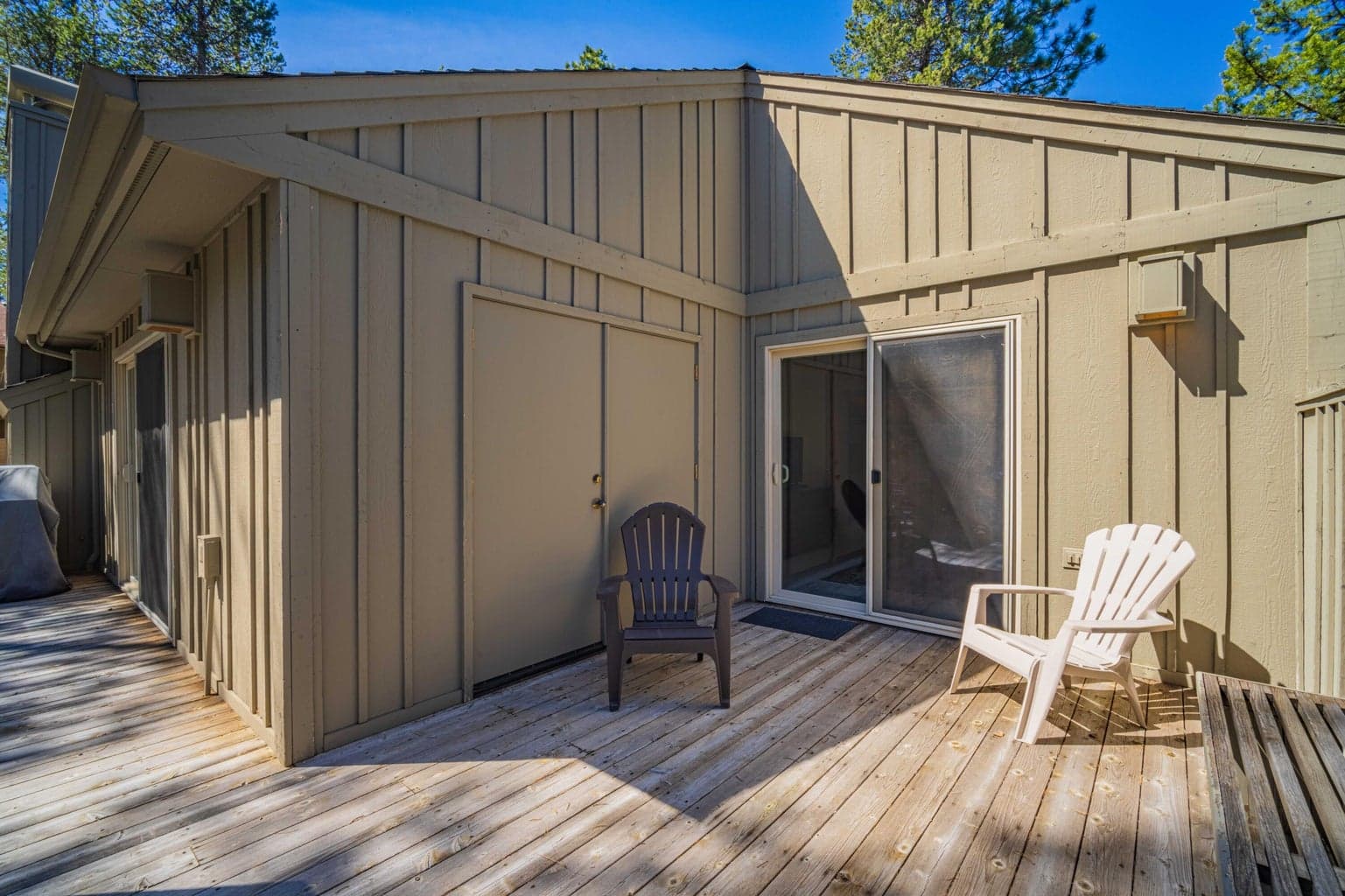 Deck access from the bedroom wing, offering convenient indoor-outdoor connection and quiet seating areas.