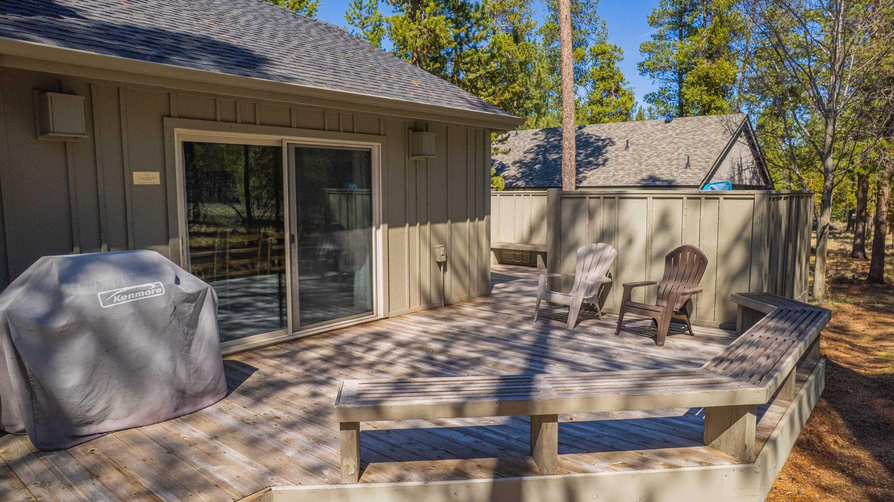 Back deck seating and grill area designed for relaxed outdoor living in Sunriver, Oregon.