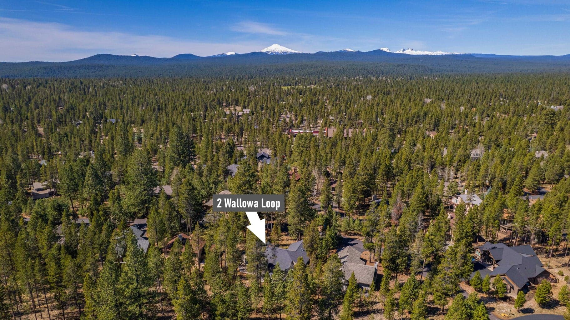 Aerial location view showing the home’s placement within Sunriver, Oregon, with the Cascade Mountains beyond.