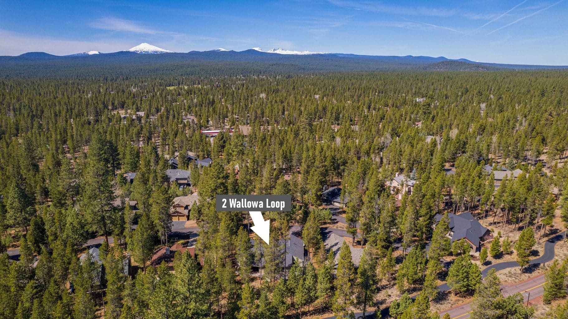 Aerial neighborhood view with location marker, showing the home within Sunriver’s forested Central Oregon landscape.