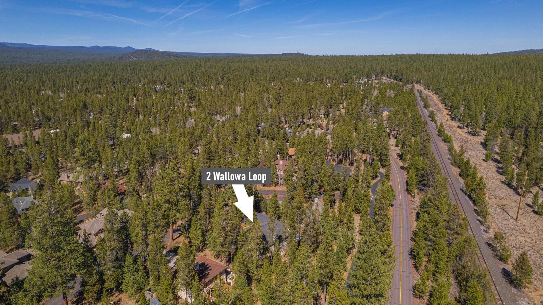 Aerial context of North Sunriver, highlighting the home’s location near the road network, trees, and surrounding resort community.
