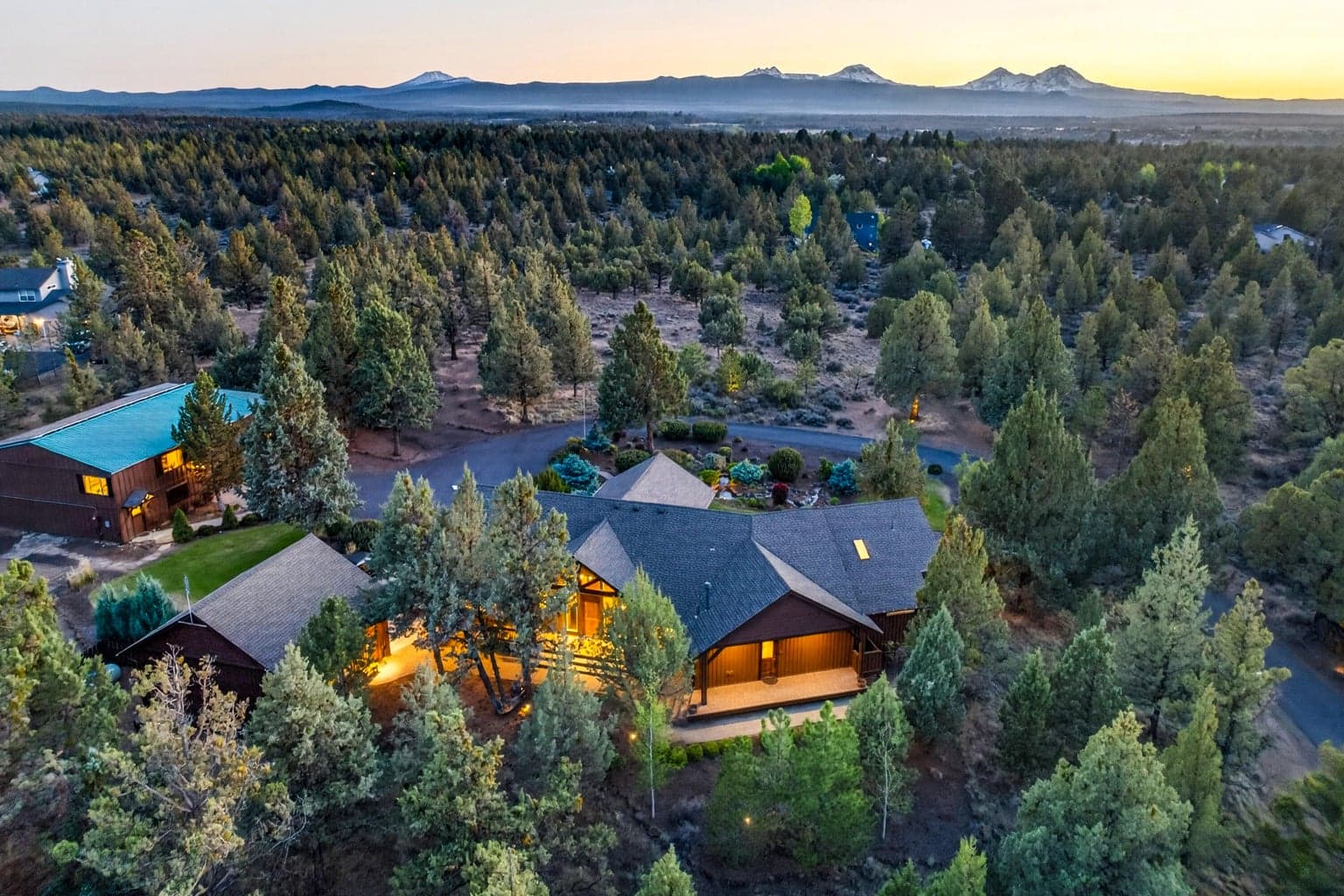Sweeping full Cascade Mountain range views define this rare 9.46-acre offering, where a custom single-level PacWest-built home, detached garage, expansive shop, and finished upper-level guest/flex quarters come together in an exceptional Central Oregon setting.