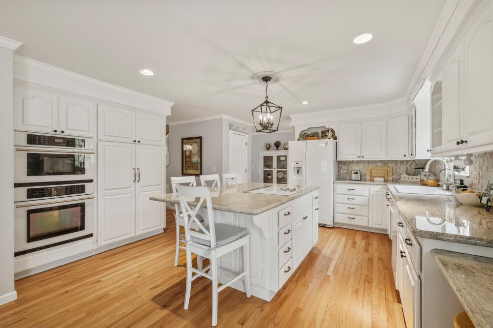 Spacious kitchen with granite and hardwood floors