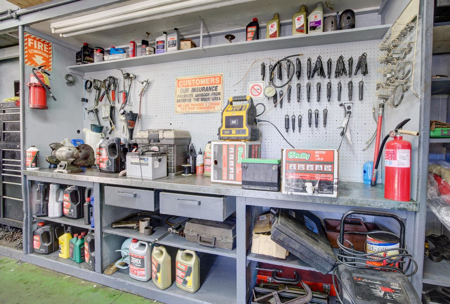 A heavy-duty workstation featuring pegboard tool storage.