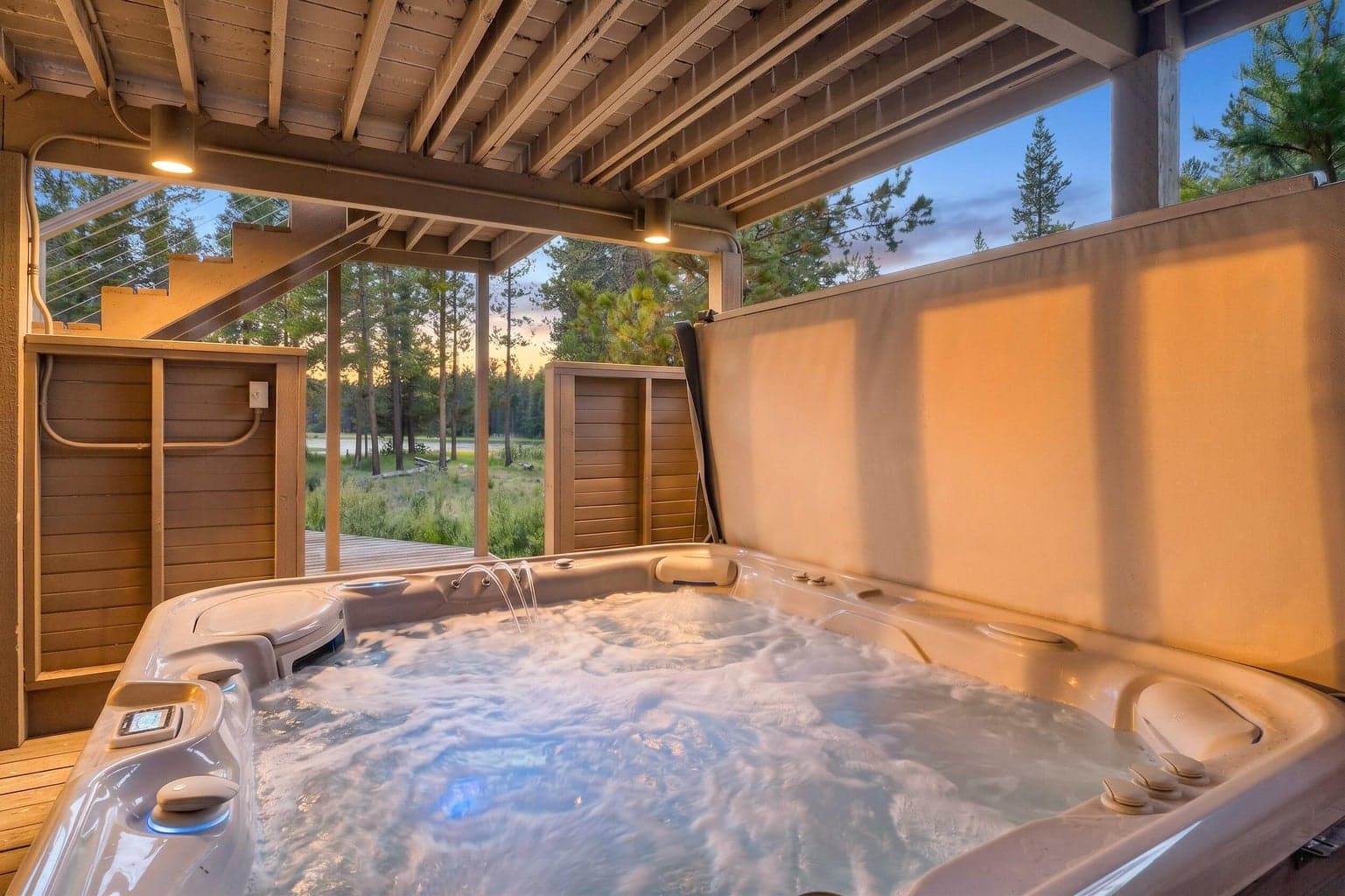 Unwind year-round in the private hot tub while enjoying peaceful river and meadow views.