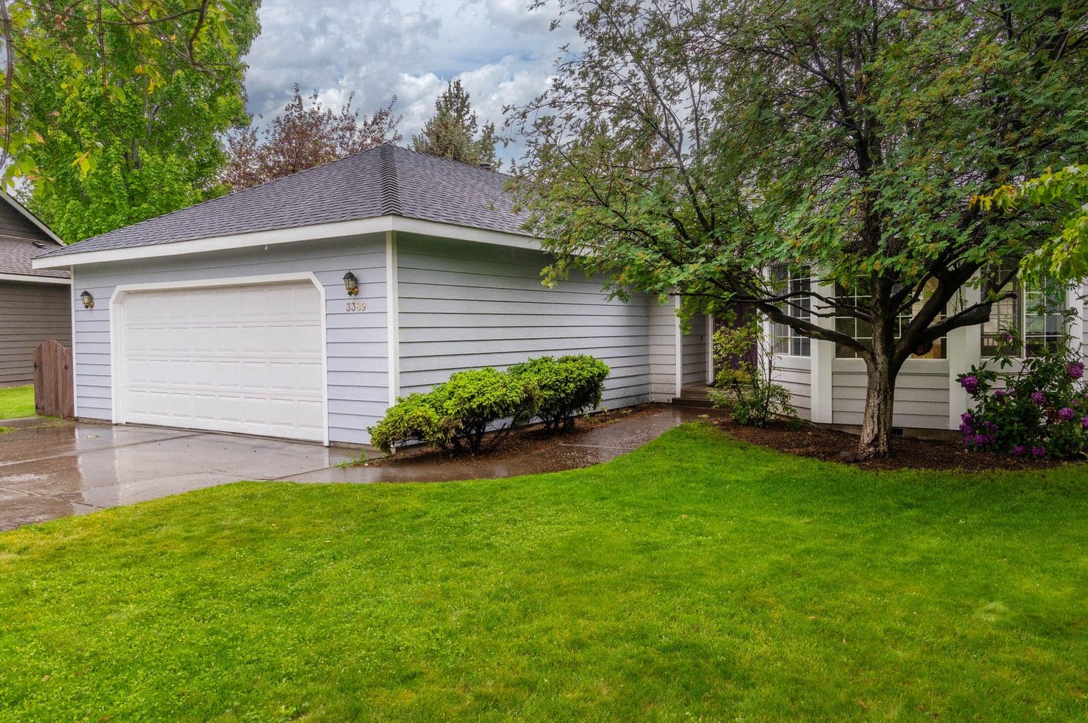 Large lawn areas on both sides and the rear of home.