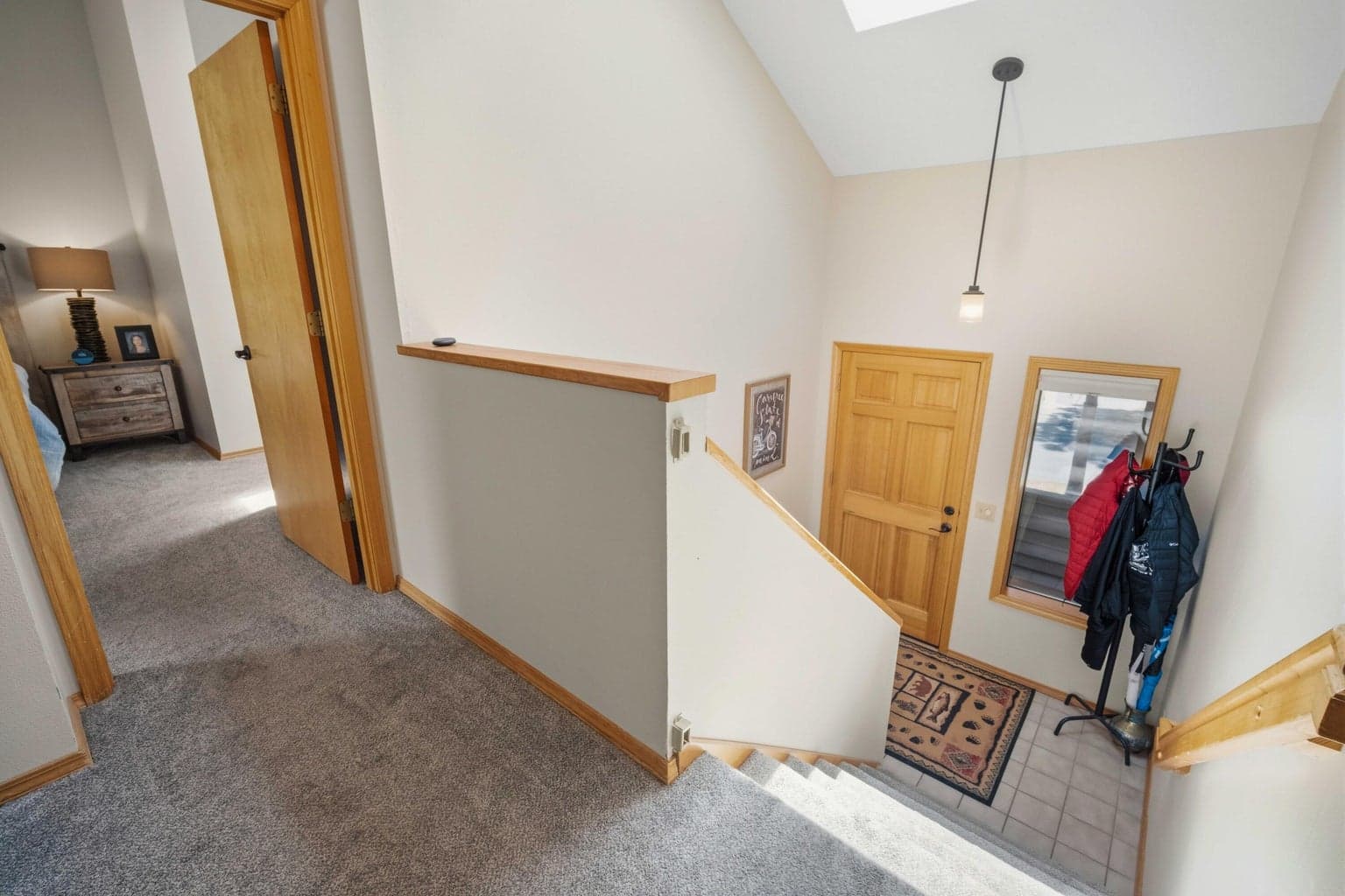 Split-level entry with natural light, skylight above, and access to main living level.