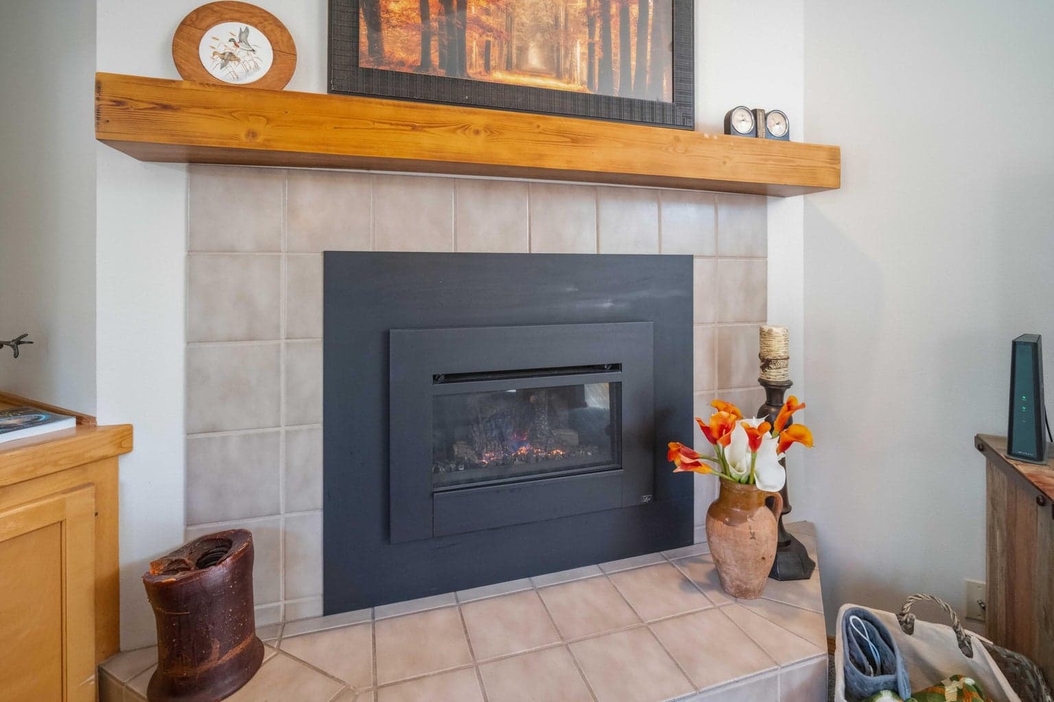 Gas fireplace with added wood mantel for a warmer, more finished great room look.