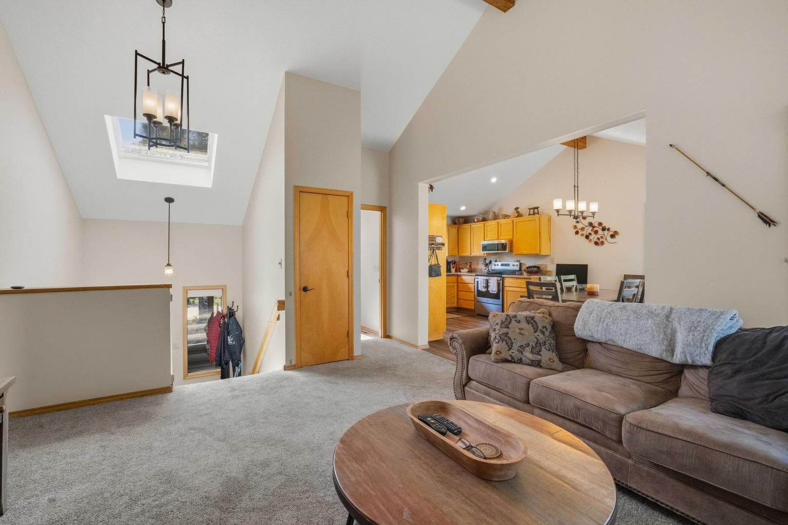 Open living area connects naturally to the kitchen, dining, and split-level entry.