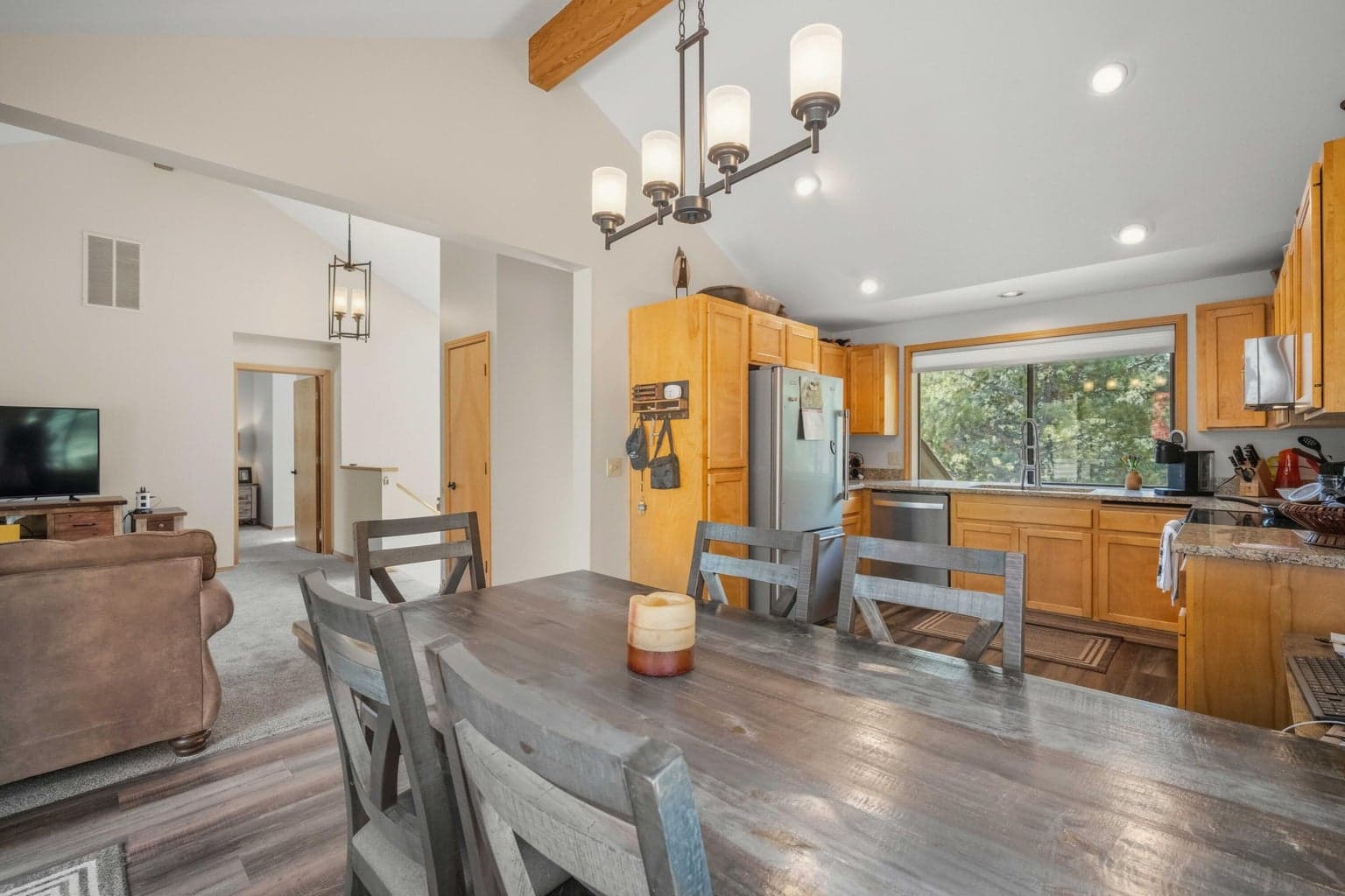 Open kitchen and dining area with vaulted ceiling and casual Sunriver gathering space.