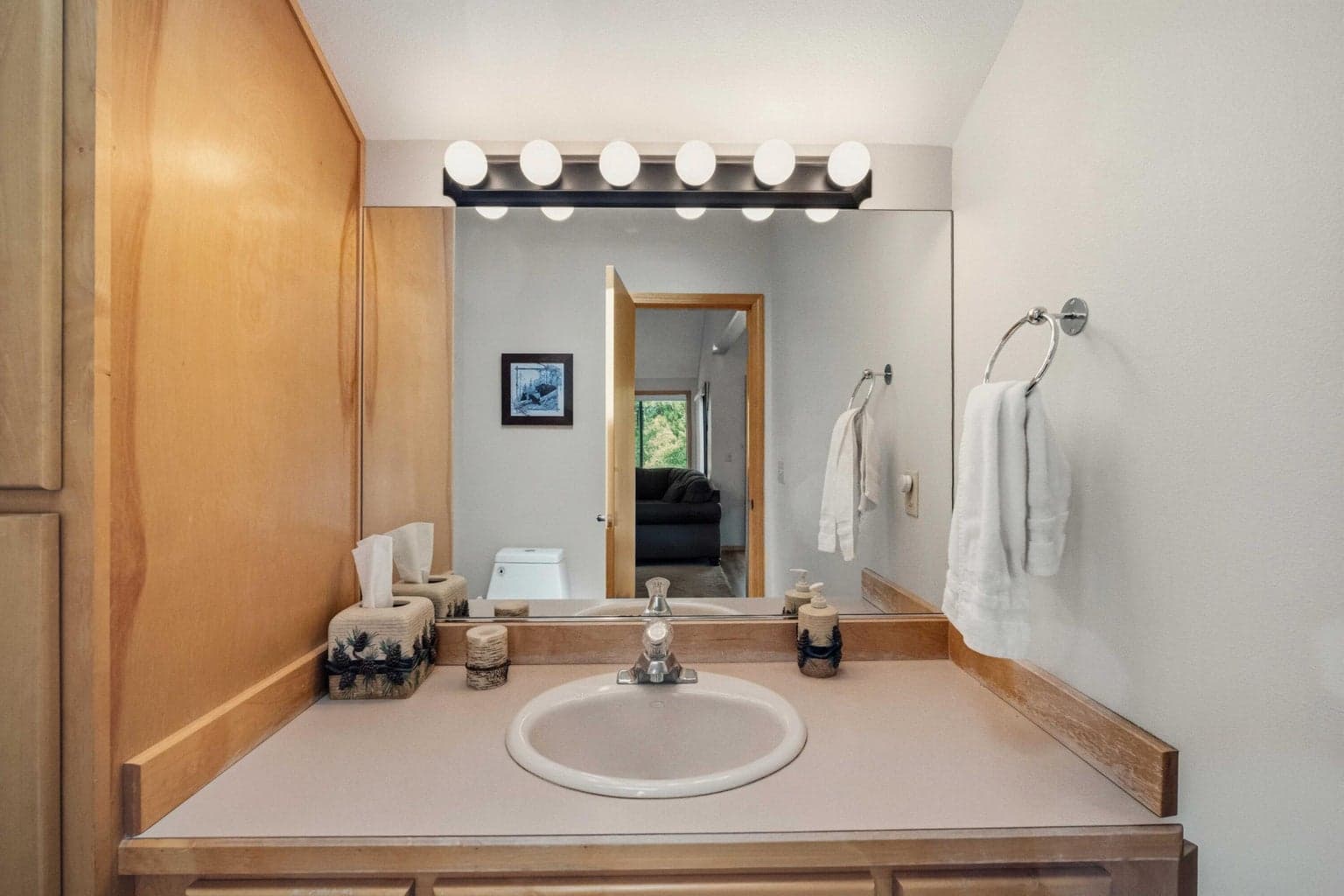 Convenient half bath on the main upper level near the primary suite and living spaces.