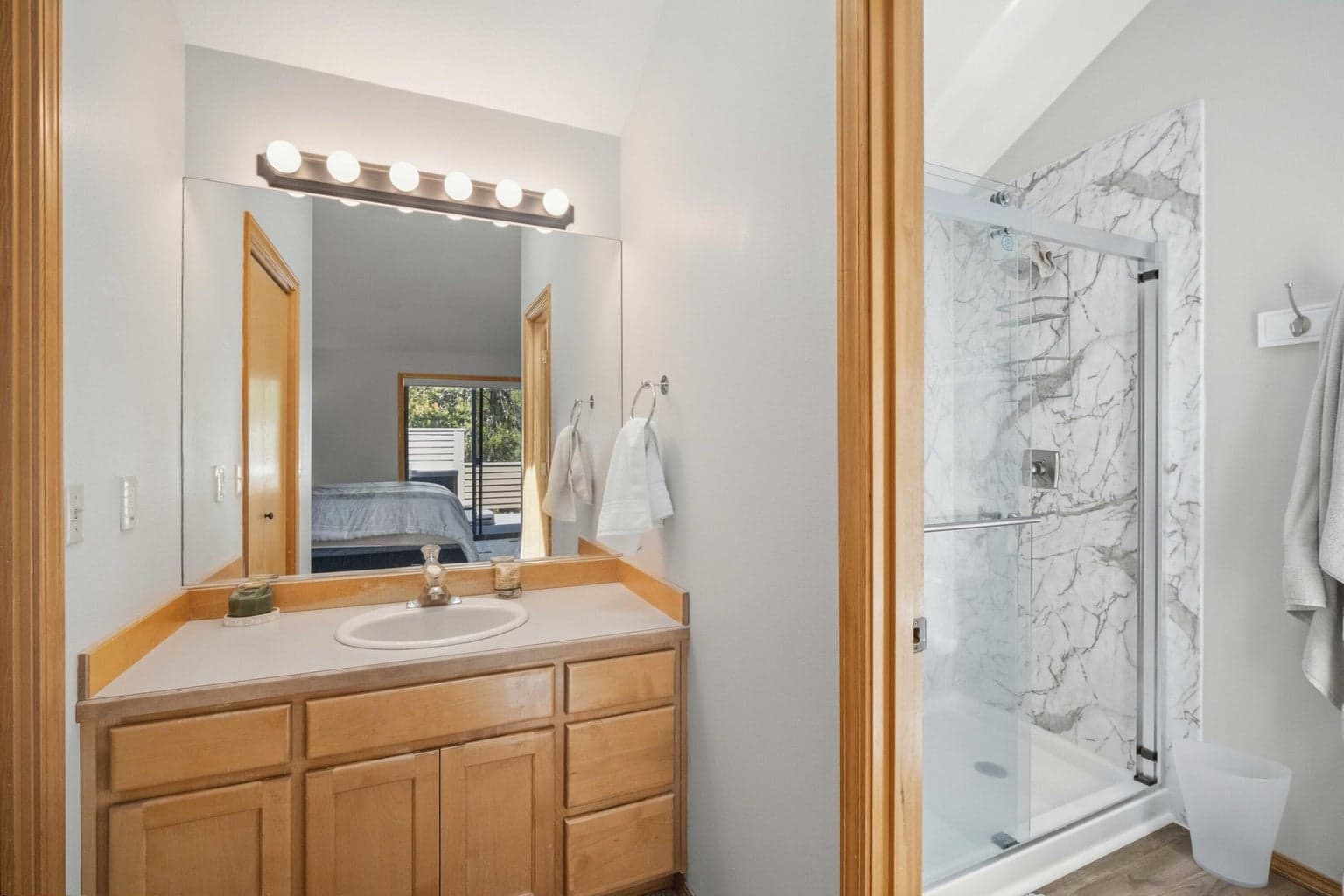 Primary bath with updated walk-in shower by Power Bath and Remodel.
