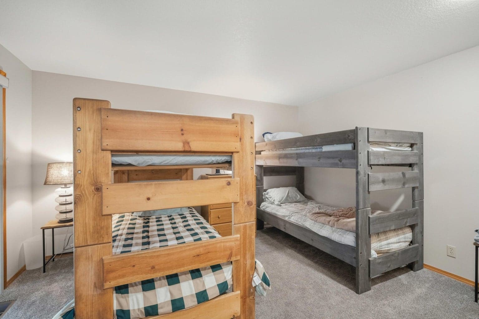 Lower-level bunk room set up for flexible guest sleeping and vacation use.