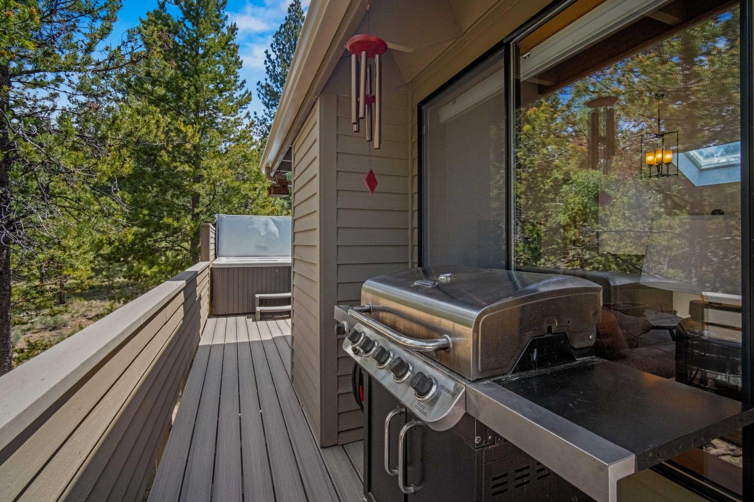 Upper deck includes grill space and direct access to the private hot tub area.