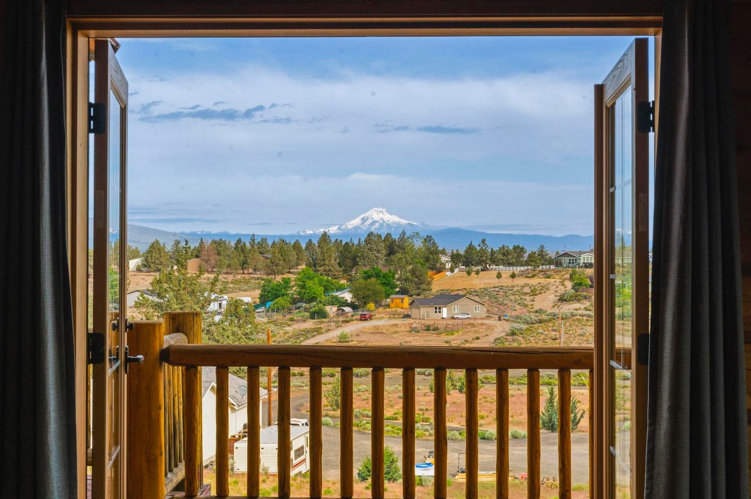 Primary bedroom views with french doors to the deck - on the main