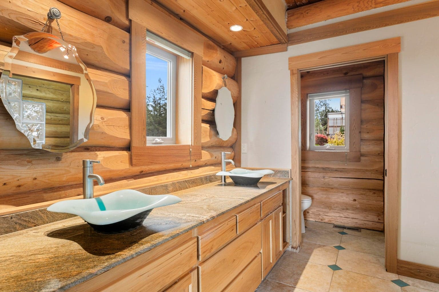 Primary bathroom double glass bowl sinks