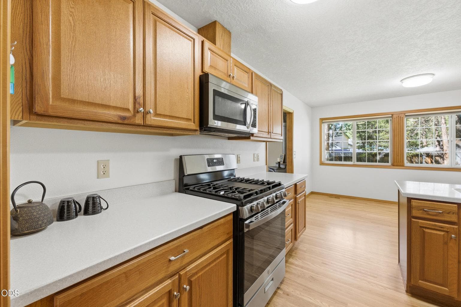 Kitchen with Corian Countertops! Great Cabinets with a lot of Storage.