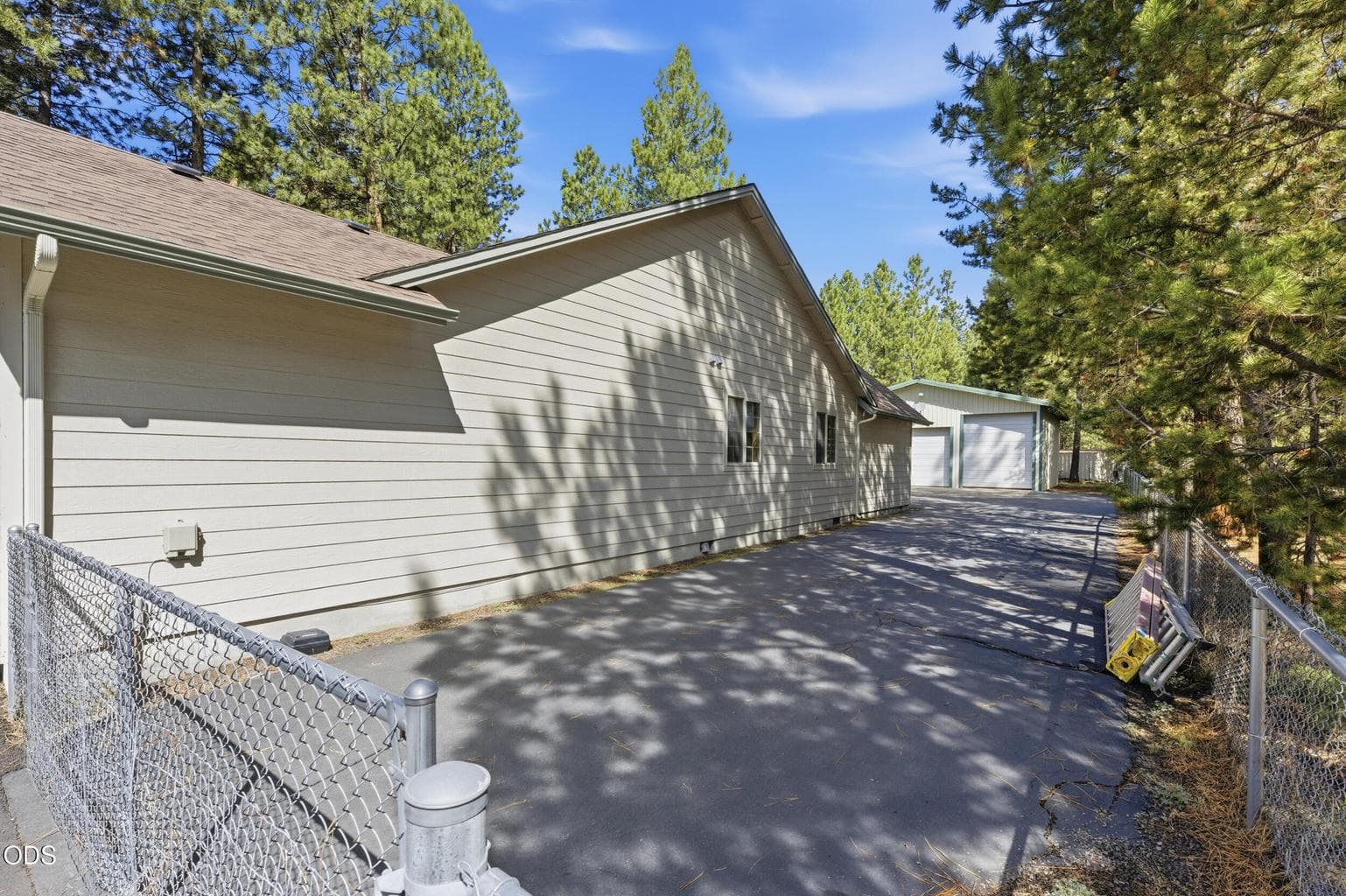 Side Yard-Fenced and Asphalt Driveway