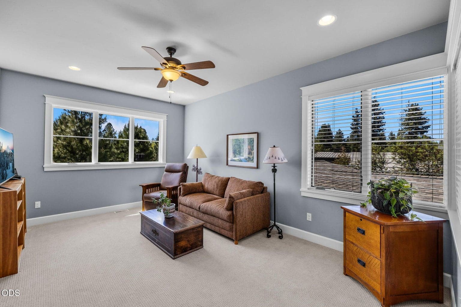 Light-filled bonus/family room located between the upstairs guest bedrooms, creating a comfortable secondary living area.