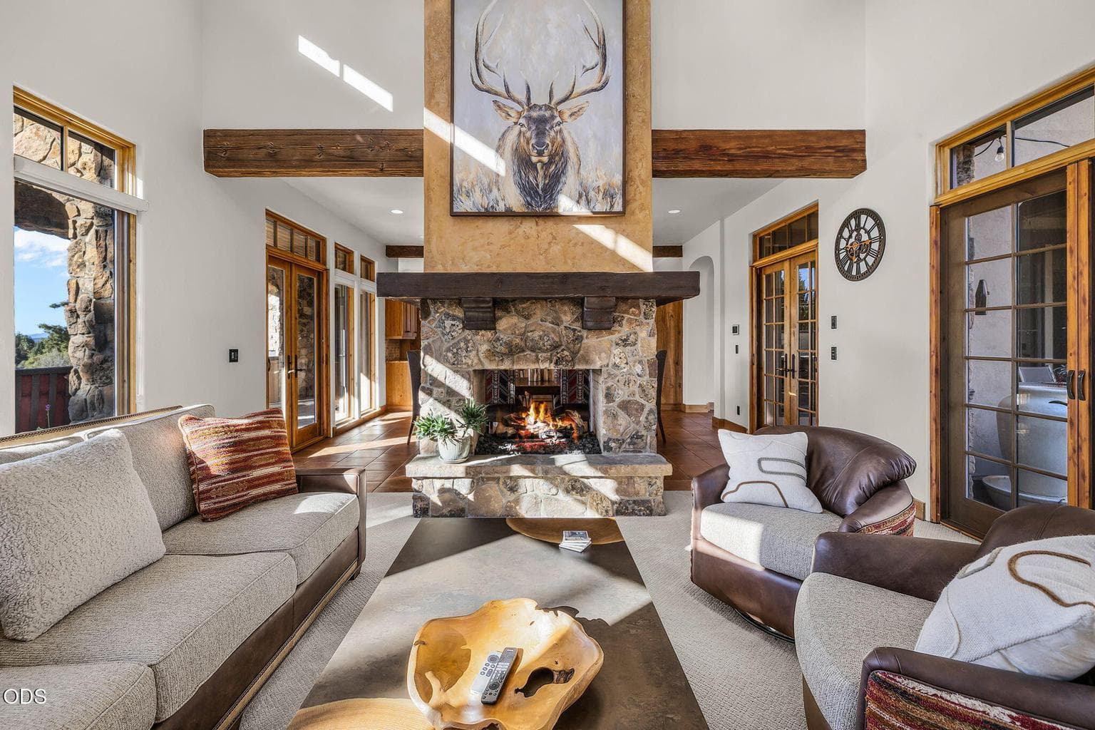 With soaring 16-foot ceilings, & exposed solid wood beams, the great room offers dramatic scale and warmth.