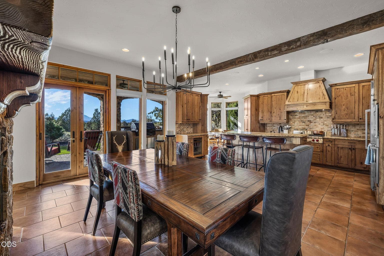 The large kitchen, dining, and great room connect seamlessly, with French doors opening to the rear patio and refreshed interior courtyard—ideal for relaxing or entertaining.