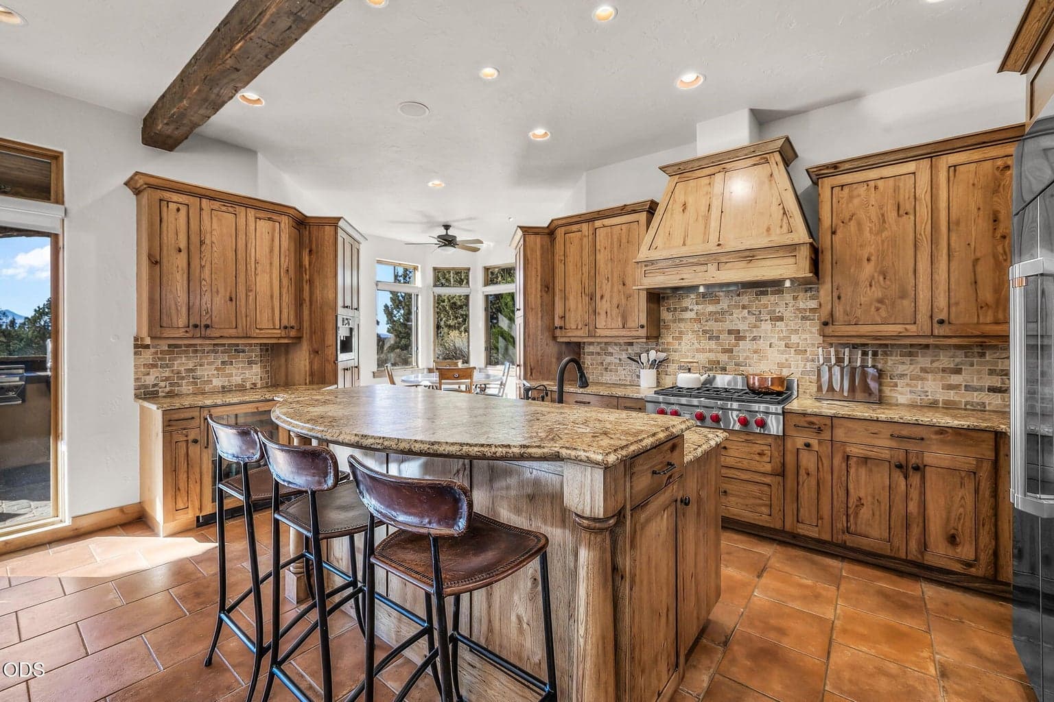 The Bar is Open! Wonderful tall bar ready to serve up snacks or hors d'oeuvres while entertaining guests and being Chef.