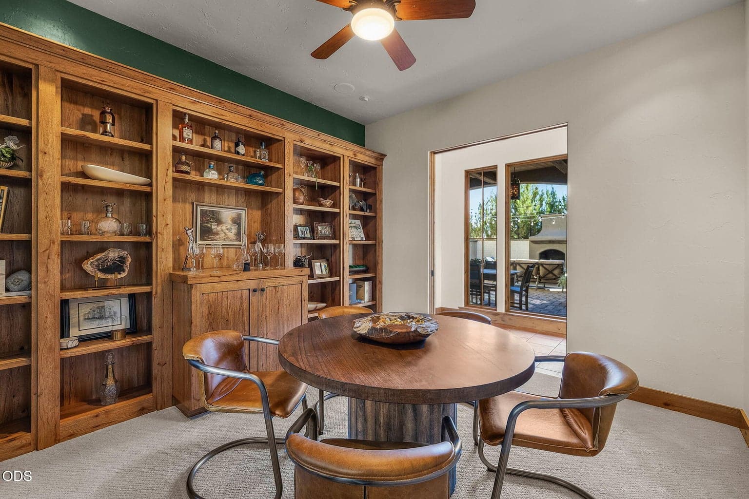 Custom solid wood built-ins elevate the bonus room, providing both style and versatility for everyday living or special use.