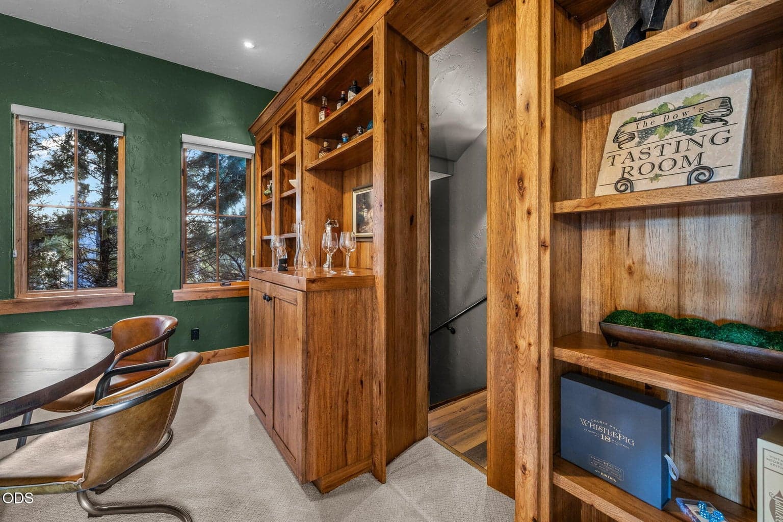 Secret door that accesses the spacious climate controlled Wine Room and large storage area.