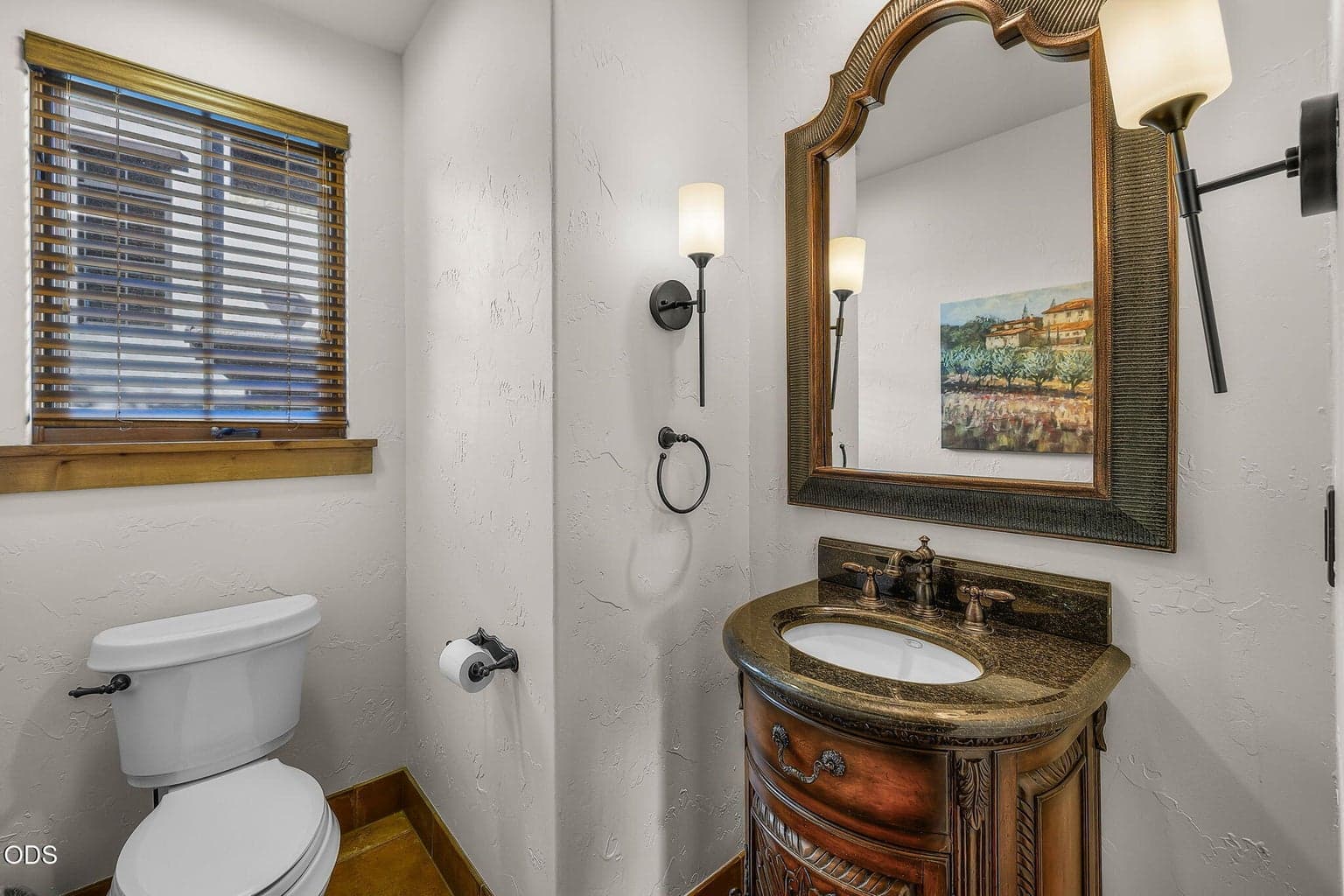 Entryway half bath is convenient to the garage, main entry and all main level living spaces.
