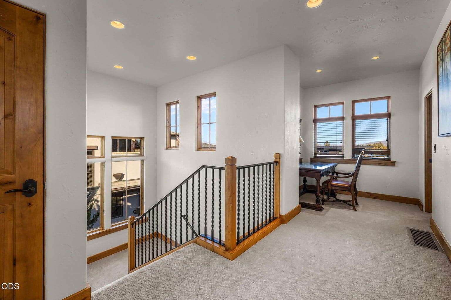 Very well lit with natural lighting, 2nd level landing is ample and includes a desk work area.