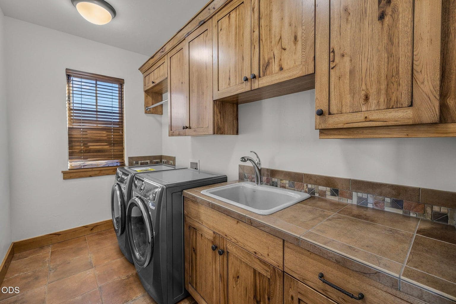 Large laundry room with new Electrolux washer and dryer. So much storage