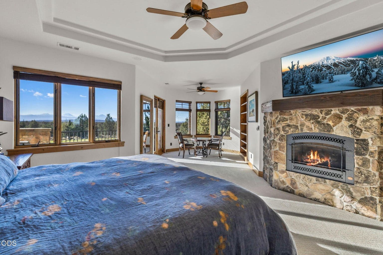 Primary features oversized room with fireplace, reading nook, with tons of natural light and endless mountain views