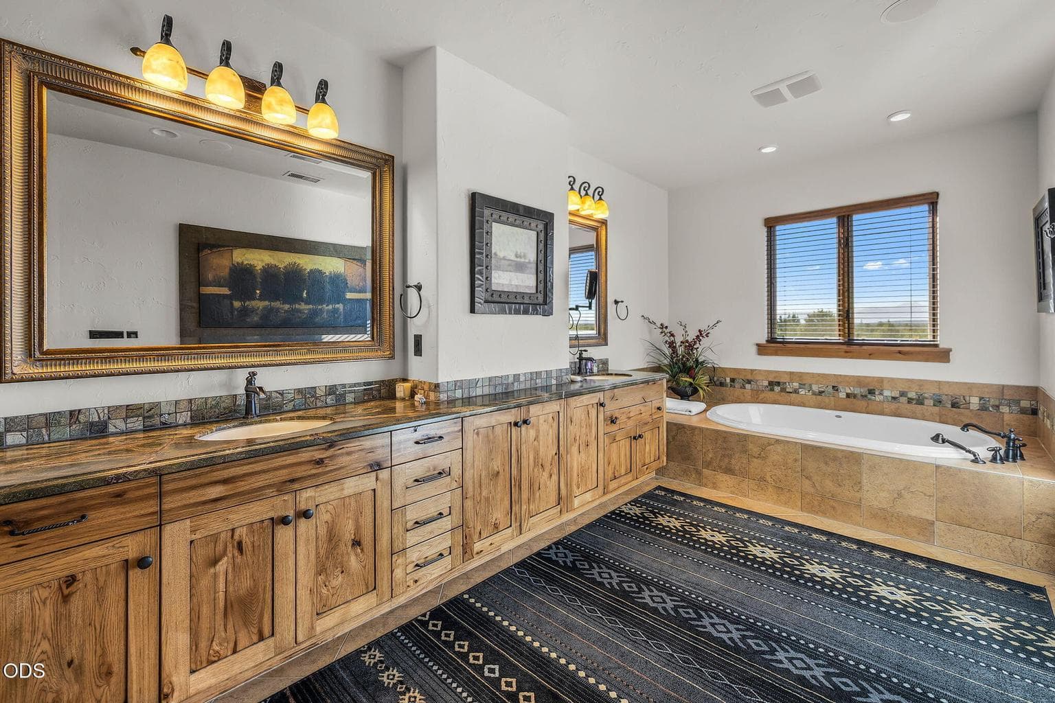 Spa inspired primary bathroom with double vanity, soaking tub, oversized double shower and separate water closet