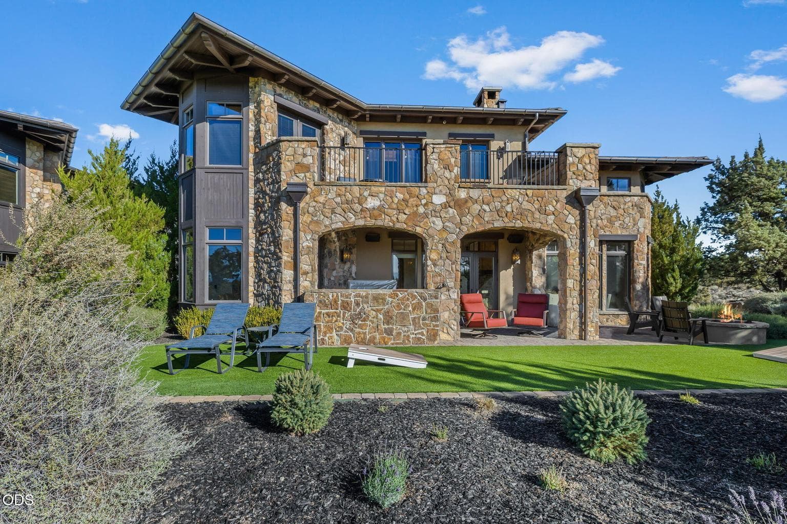 Classic natural stone construction creates a timeless aesthetic while ensuring low-maintenance living.