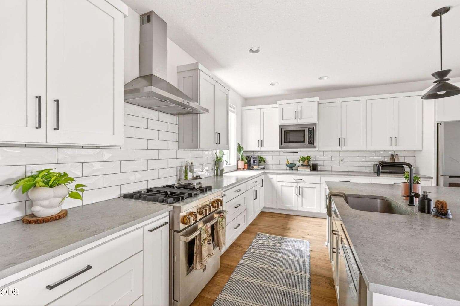 Kitchen with gas range and hood