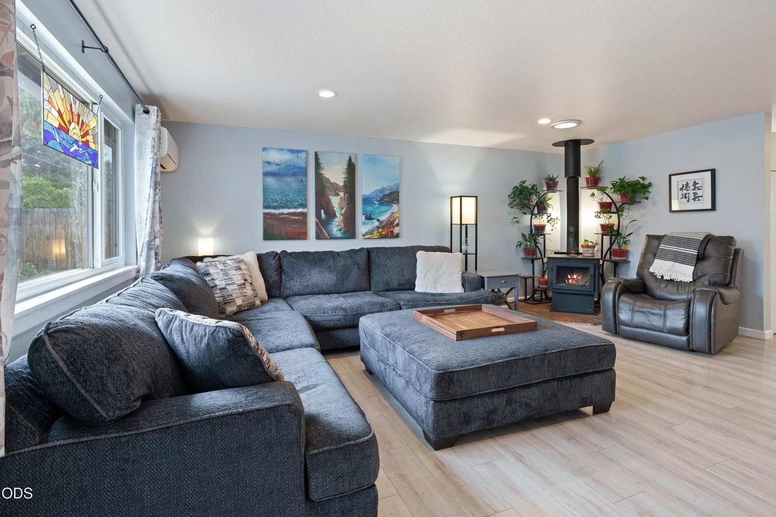 Great room of main home with wood burning fireplace