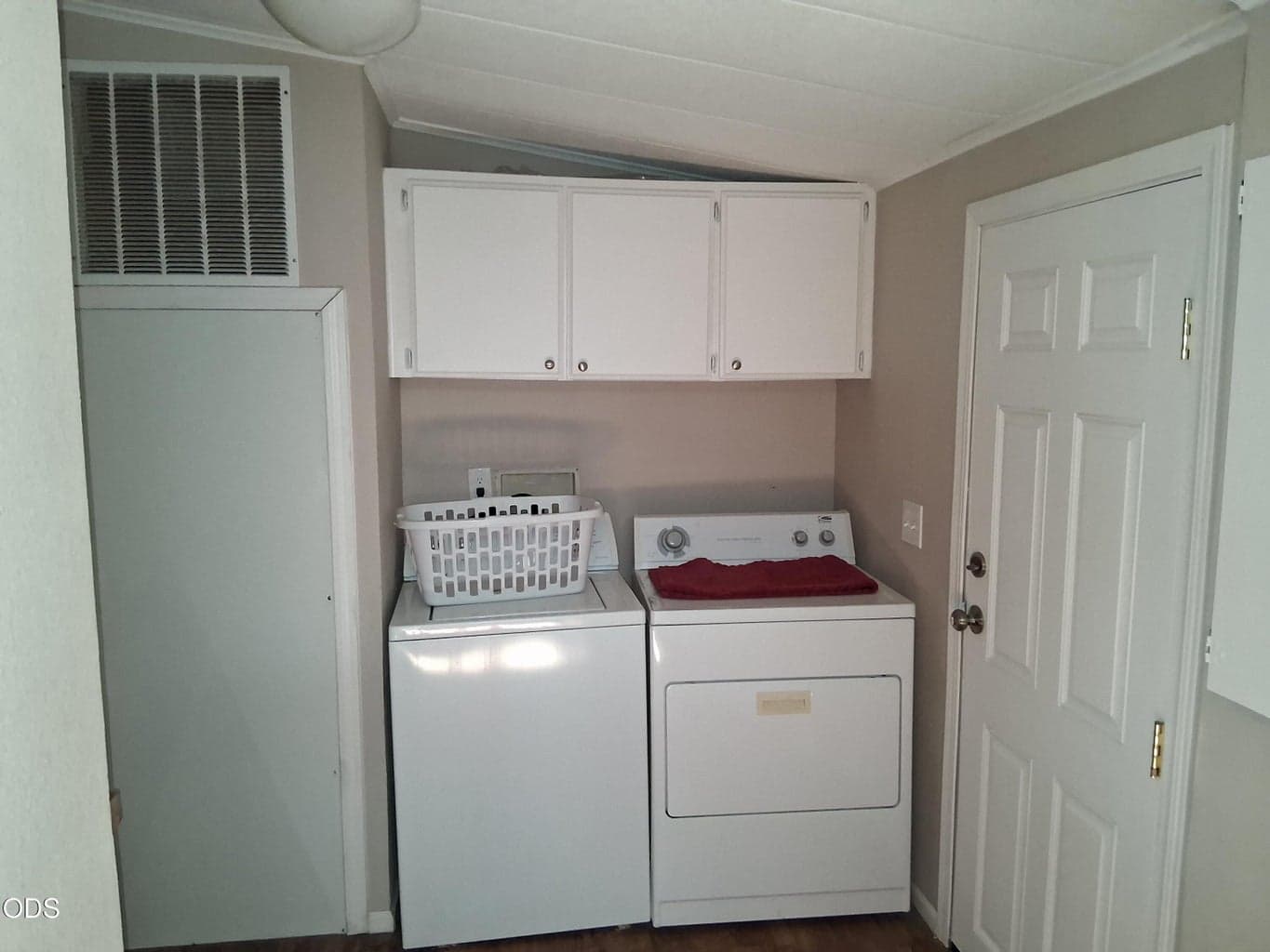 Laundry room with back door to back covered porch. Half bath off of laundry room