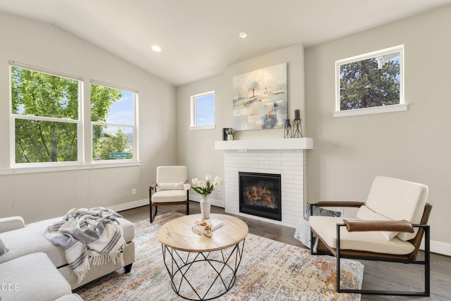 Vaulted ceilings, hardwood floors and walls of windows make this great room a GREAT room!