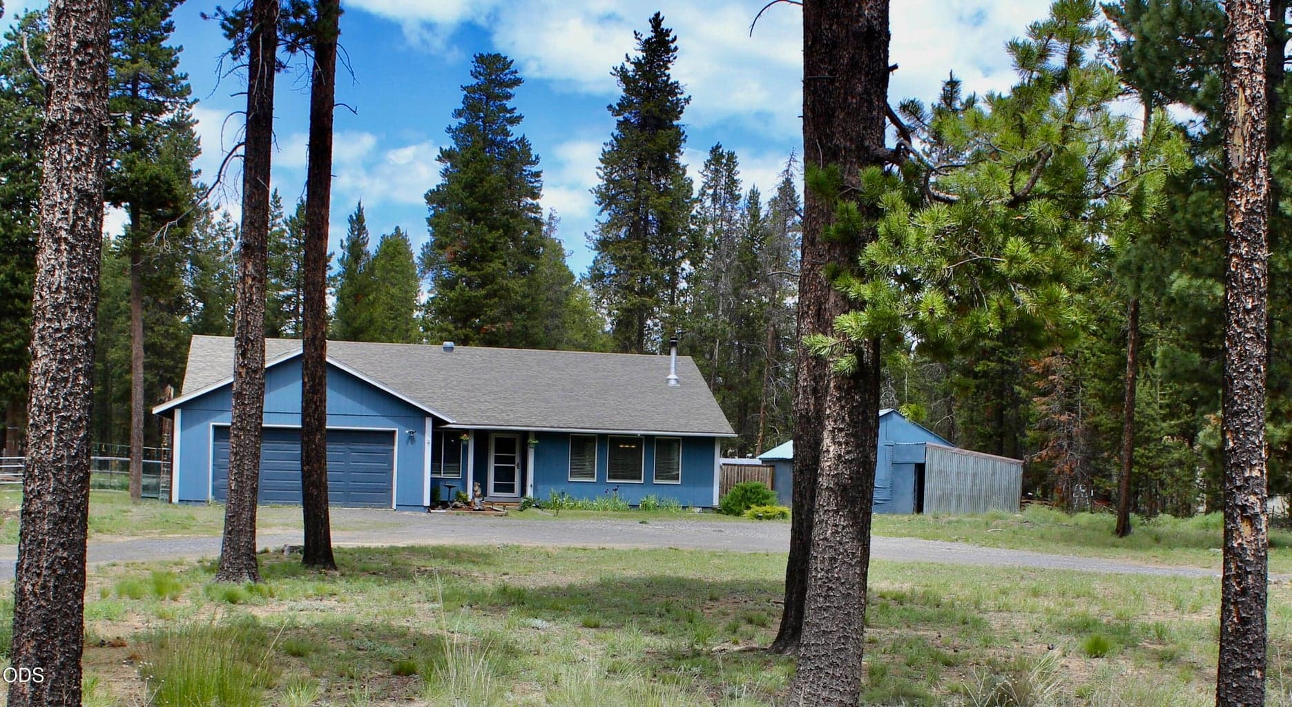 House from street. Has two entrances/circular driveway for easy access.
