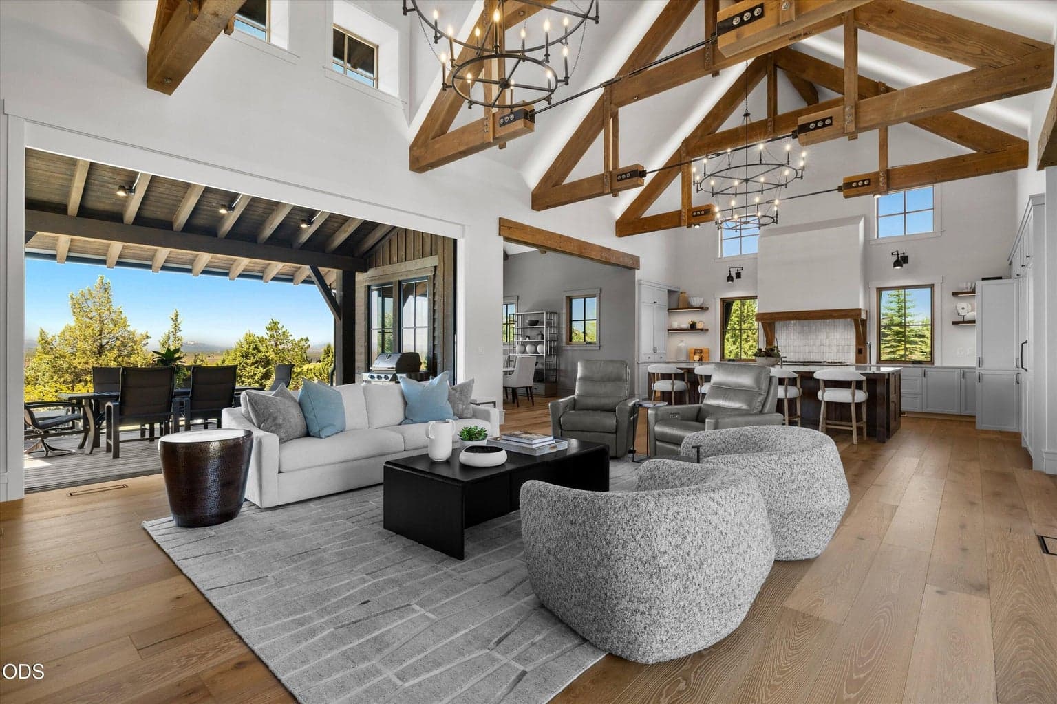 Majestic beams and chandeliers flow seamlessly with the outdoor landscape