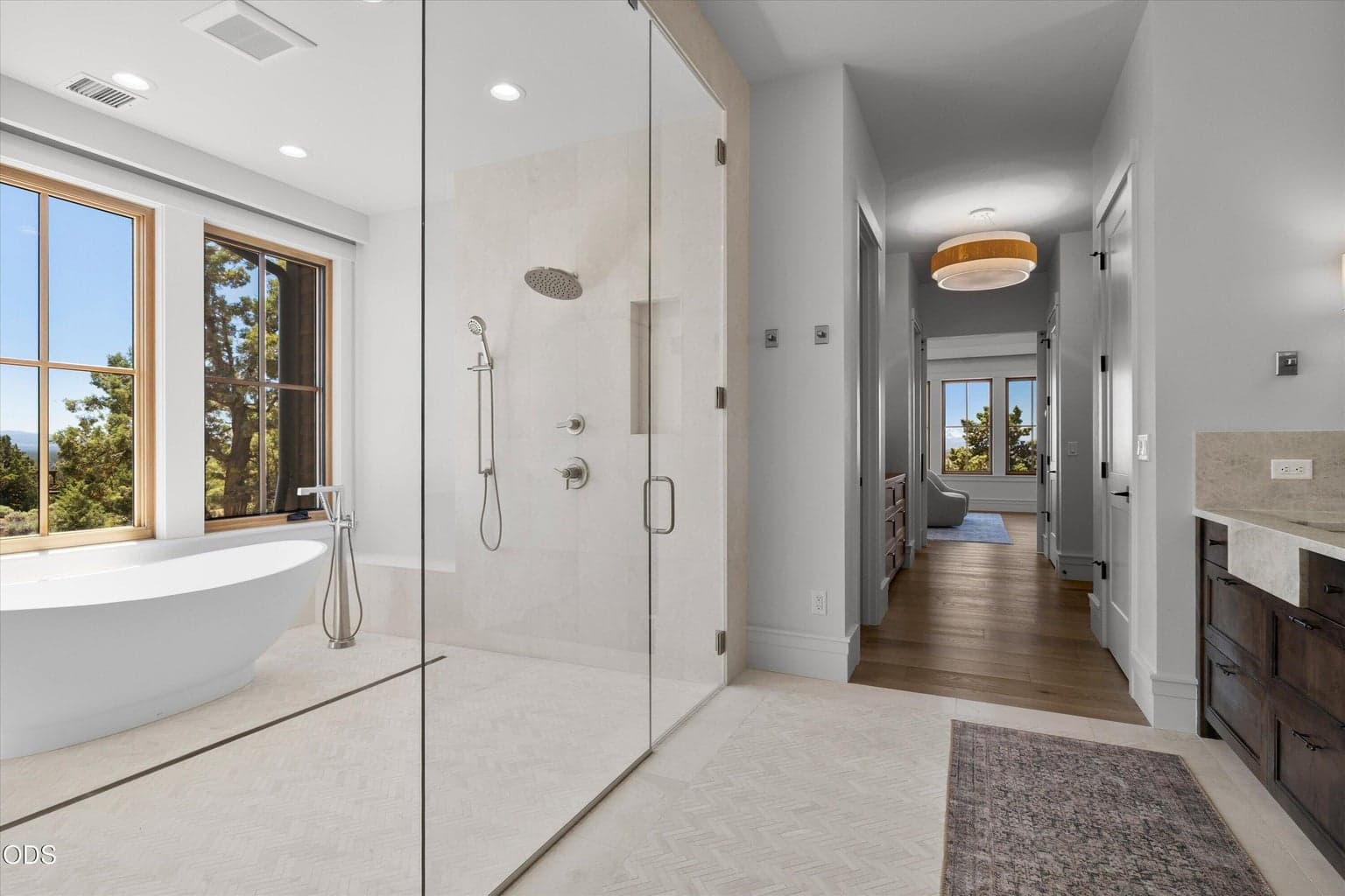 Radiant heated floors, one-touch window treatments, and luxury finishes are only some of the special touches added to every inch of this home