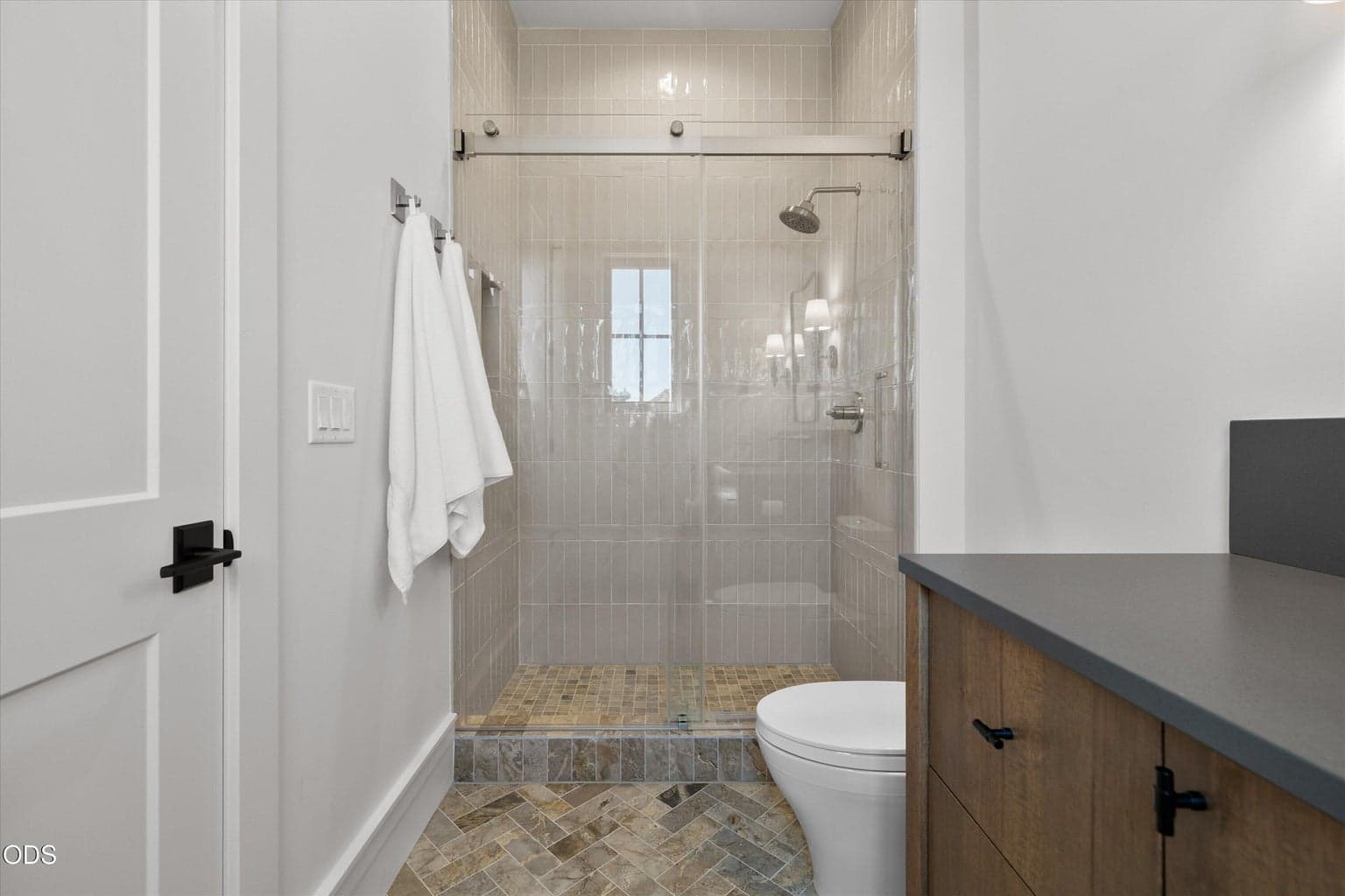 One guest suite includes a vanity, walk-in shower, and walk-in closet