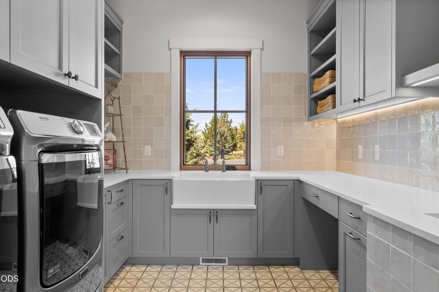 Laundry room features included washer and dryer, mud sink, and dog washing station