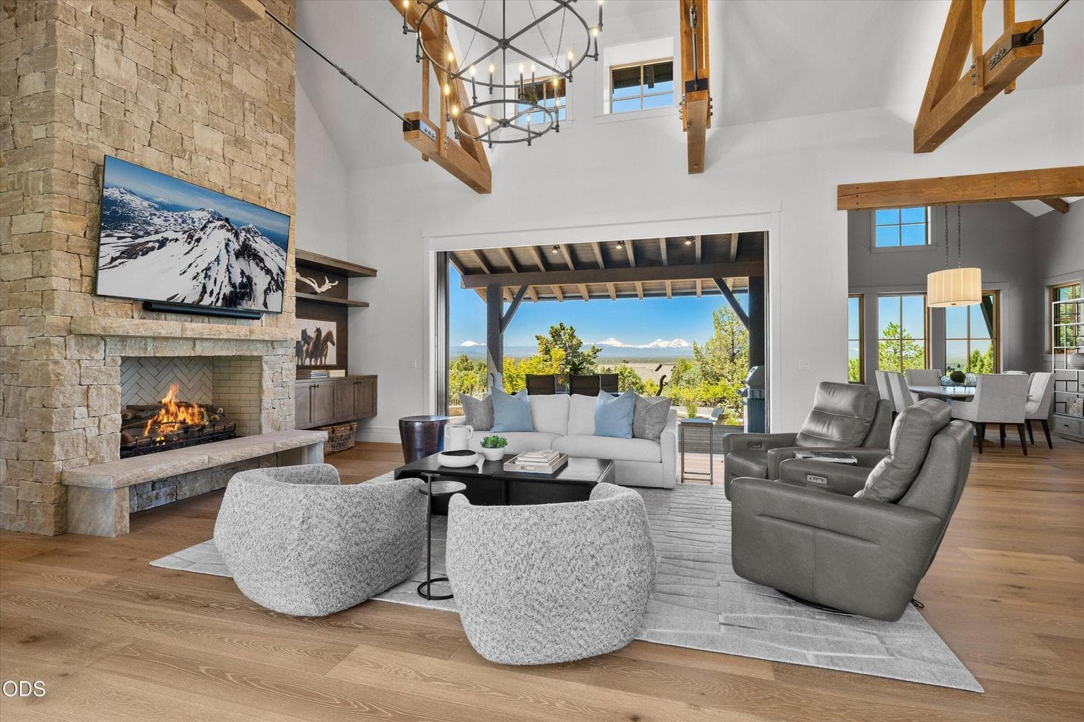 Multi-slide pocket doors vanish to connect the covered deck to the great room
