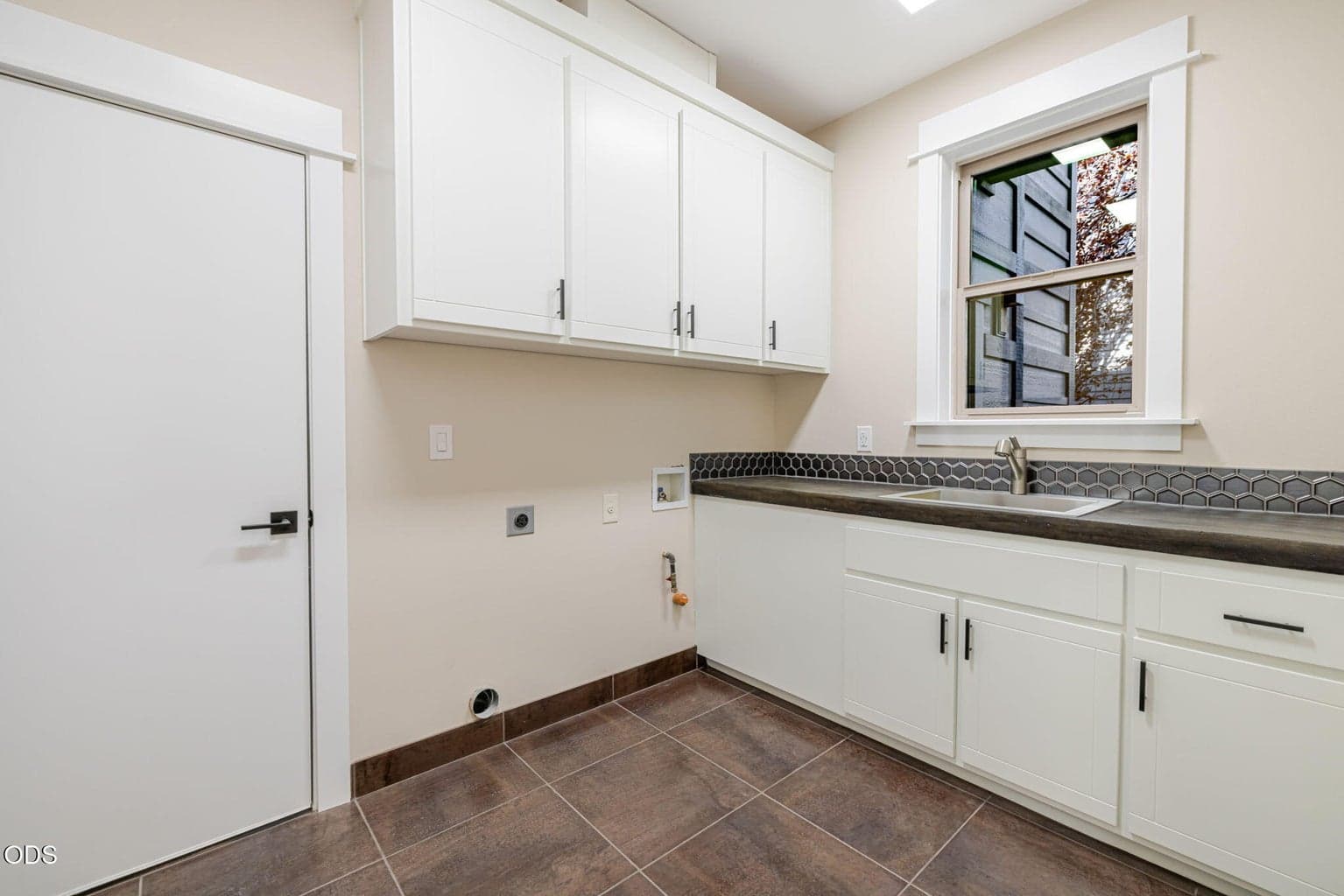 Laundry Room w/ Ample Storage and Utility Sink