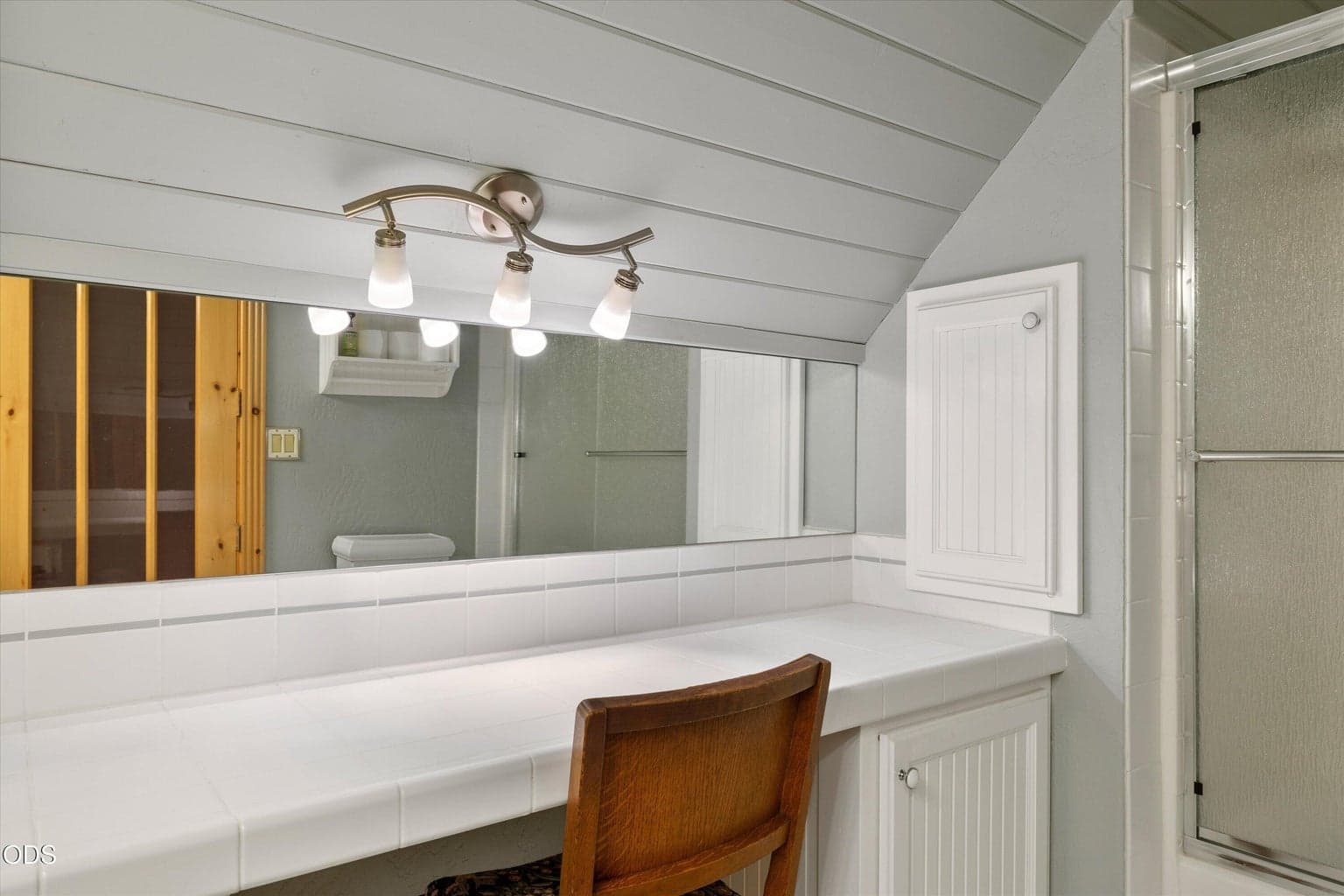 Full bath upstairs has a tub shower combo and a well-lighted, full vanity