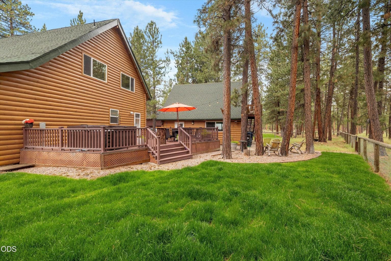 Looking toward the rear deck from the fenced yard.