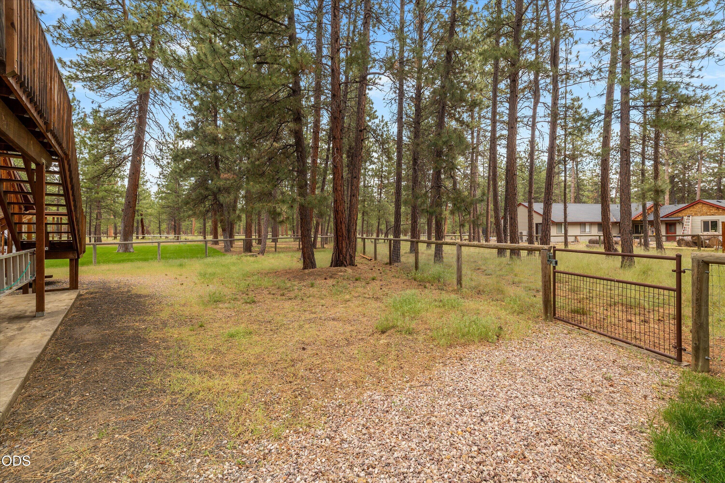 Rear area behind the garage has a gate that opens to community space.