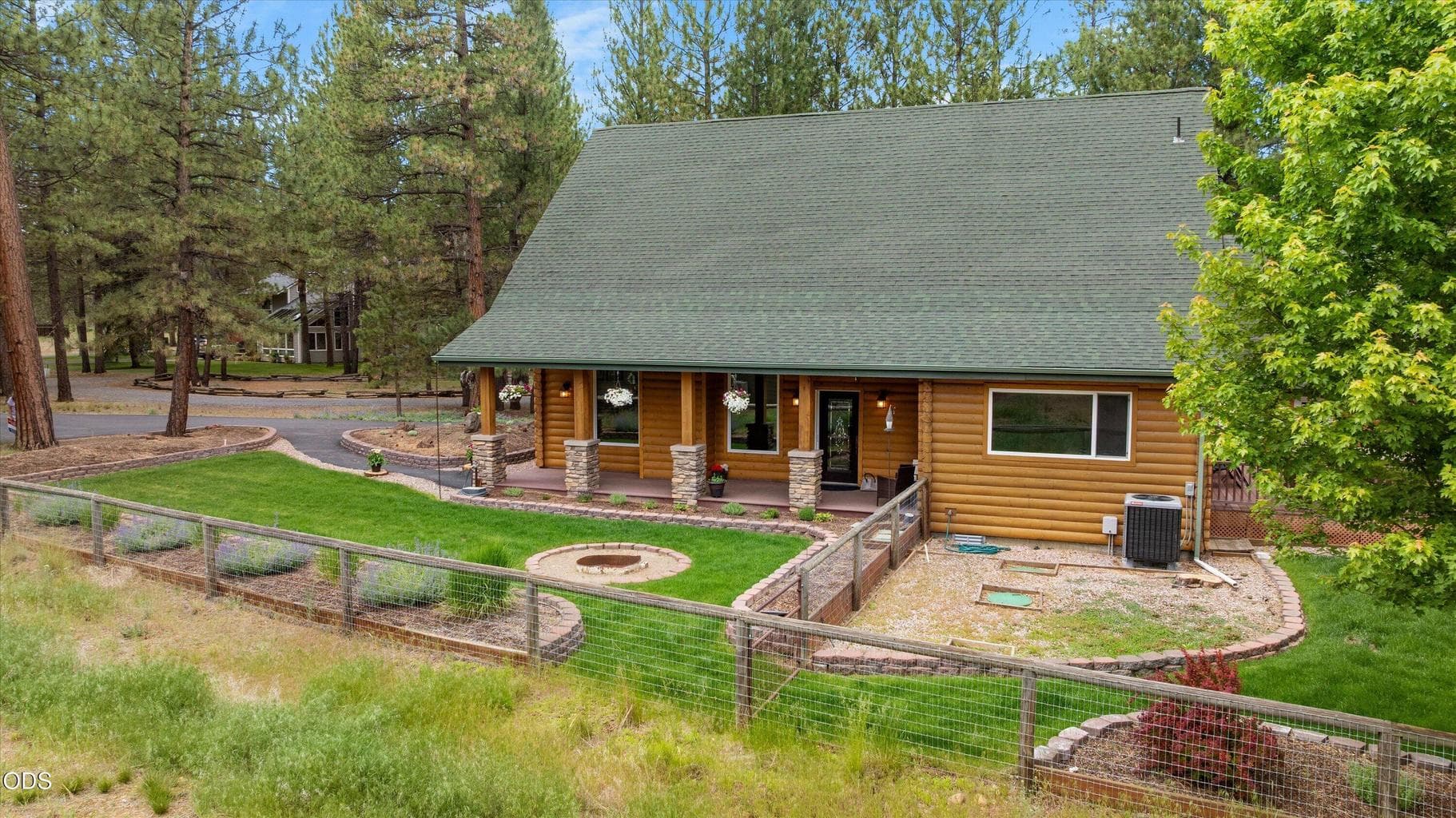 View of fenced rear yard and right elevation of home.